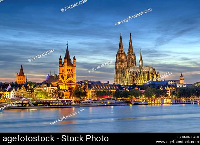 View of historical center of Cologne from Rhine river in evening, Germany