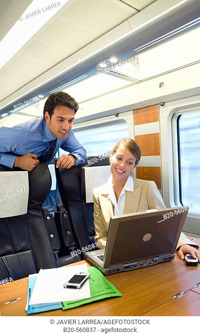 Businessmen working connected to the internet. Passenger. AVE, Tren de Alta Velocidad, Zaragoza, Aragón. Spain