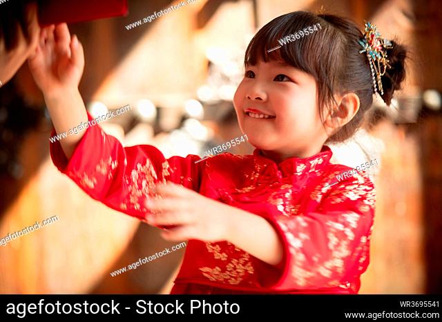 Happy New Year receive red envelopes little girl