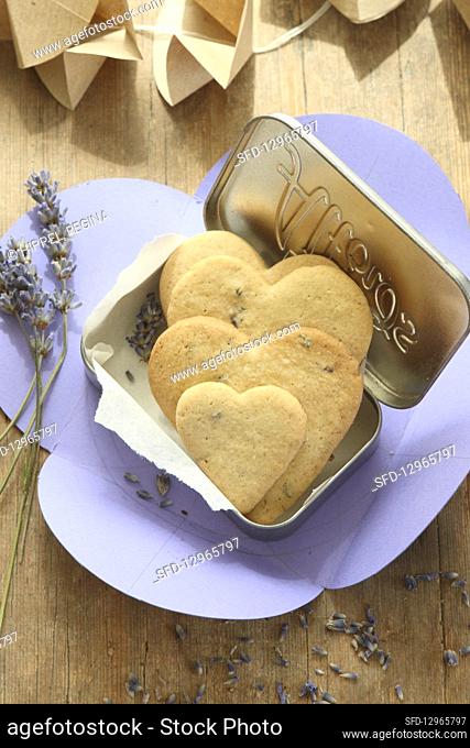 Heart-shaped, gluten-free lavender shortbread biscuits in a biscuit tin