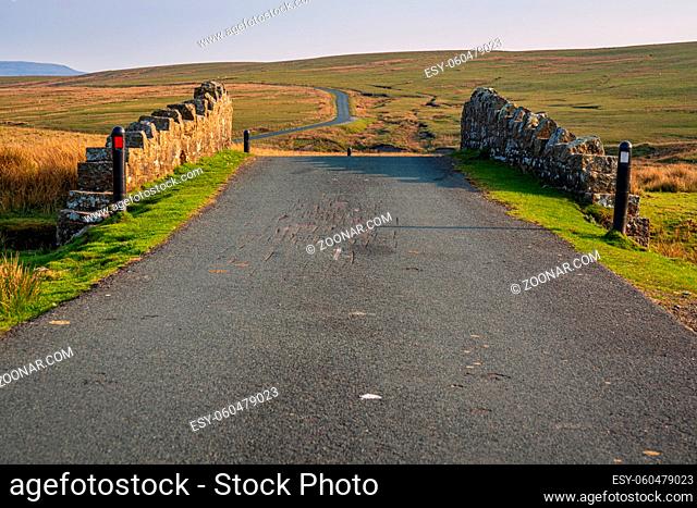 Rural road in the Yorkshire Dales near West Stonesdale, North Yorkshire, England, UK