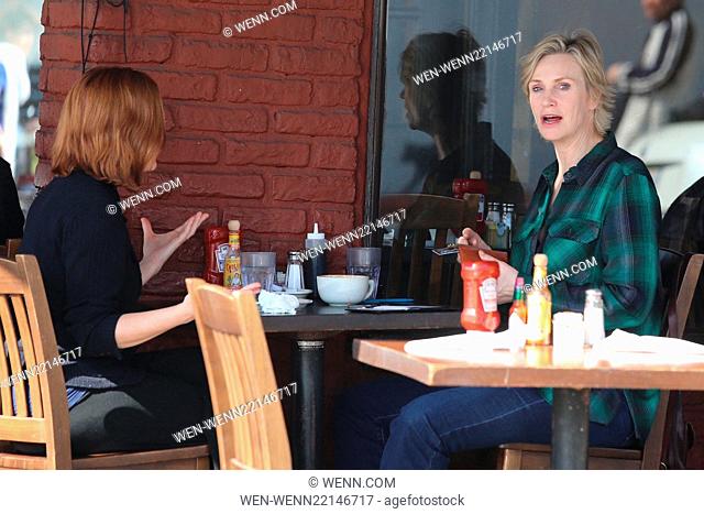 Jane Lynch pays for her lunch with a friend at King's Road Cafe with her American Express Card. Featuring: Jane Lynch Where: Los Angeles, California