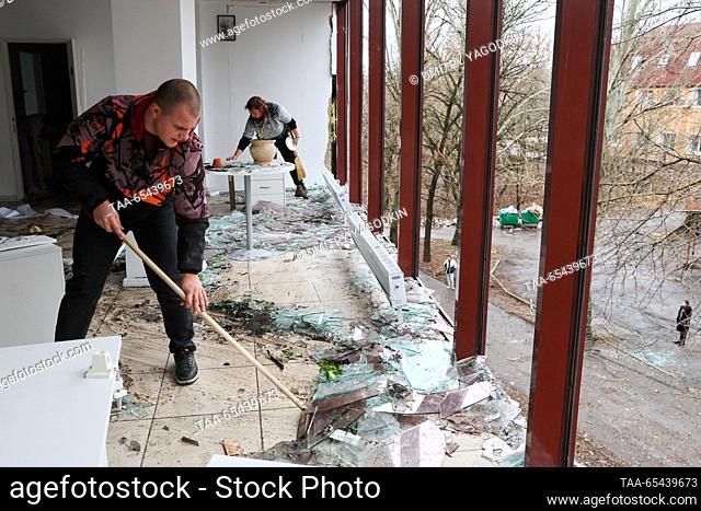 RUSSIA, DONETSK - DECEMBER 3, 2023: A man clears broken glass from the floor of a beauty parlour damaged in a shelling attack by the Ukrainian Armed Forces
