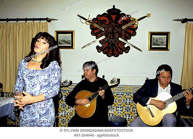 Fado singer and guitarists in a night club. Lisbon. Portugal