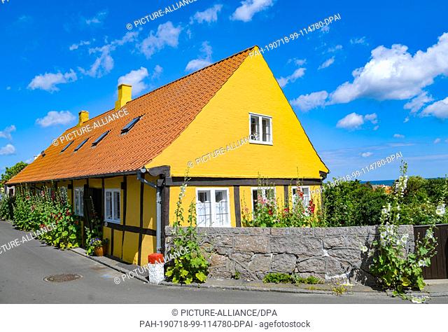 28 June 2019, Denmark, Svaneke: A typical residential house in Svaneke, a small town on the north-eastern edge of the Danish Baltic island of Bornholm