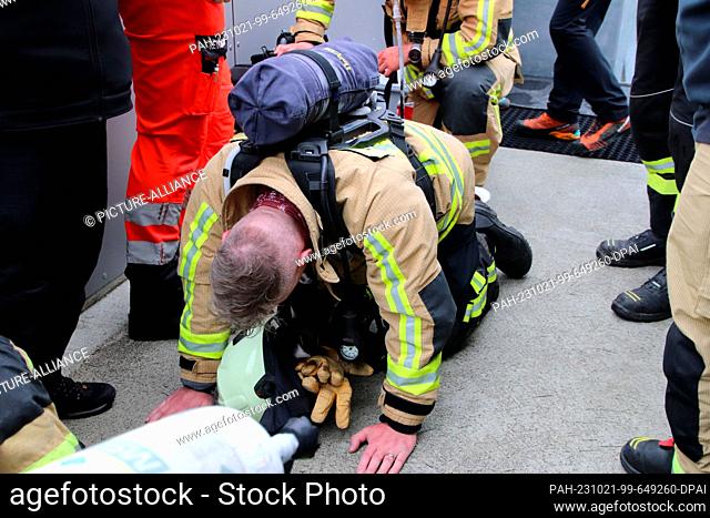 21 October 2023, Oberstdorf: Firefighters are completely out of breath after climbing the 1, 000 steps of the Heini-Klopfer ski jump in full bandolier gear...