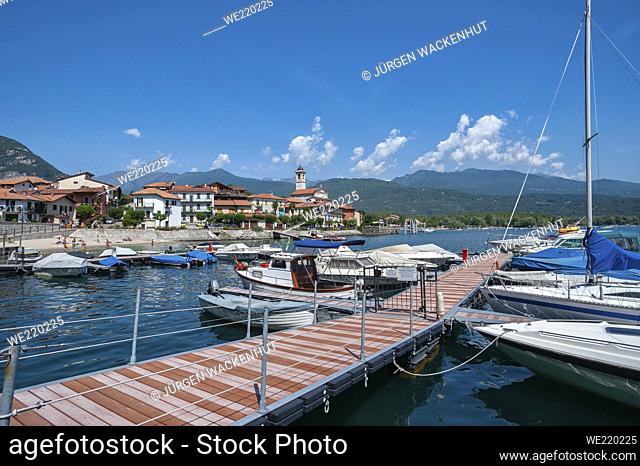 Small harbor with town view, Feriolo, Piedmont, Italy, Europe. Small harbor in front of the village of Feriolo on Lake Maggiore