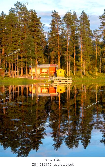 cabin at Lilträsket lake at Rännuddens campsite in Lapland, Sweden