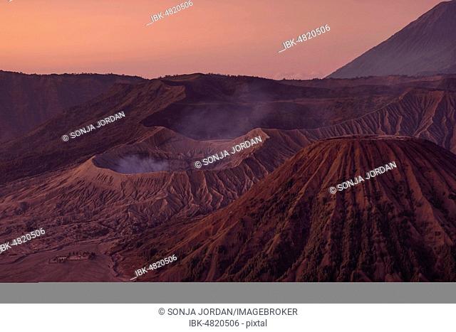 Volcanic pipes with smoking volcano Gunung Bromo, Mt. Batok, Mt. Kursi, Mt. Gunung Semeru, National Park Bromo-Tengger-Semeru, Java, Indonesia
