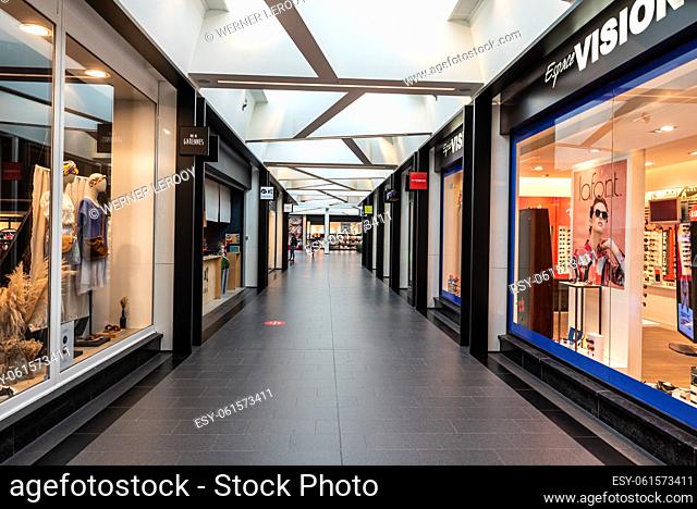 Woluwe-Saint-Pierre, Belgium - 08 20 2020 - Contemporary shopping center at the Stockel railway station