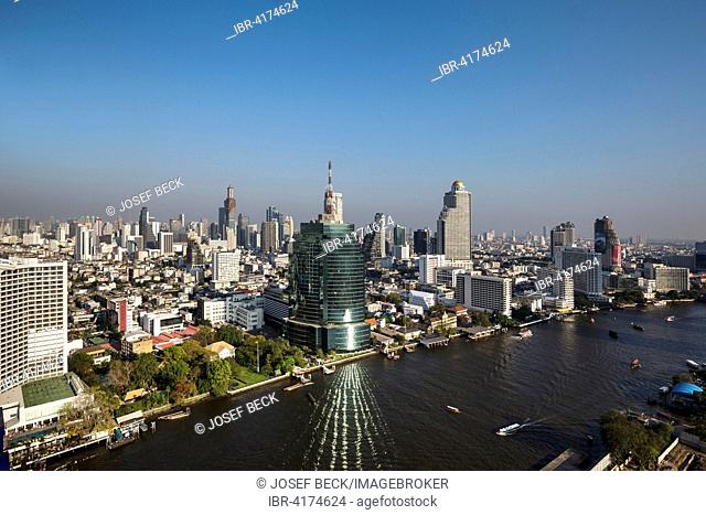 View of skyline, CAT Telecom Tower and Lebua State Tower from Millennium Hilton, Chao Phraya river, Bangkok, Thailand