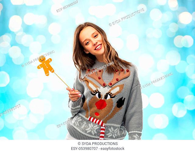 woman in christmas sweater with party accessory