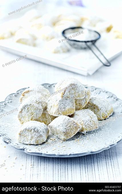 Sesame shortbread biscuits coated in icing sugar