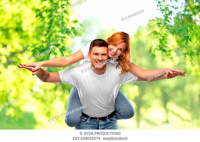 happy couple in white t-shirts having fun