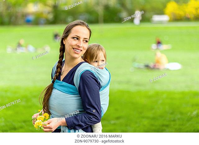 mother and child in baby sling