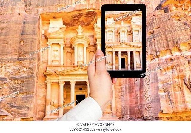 tourist taking photo of Treasury Monument in Petra