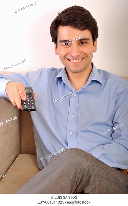Smiling man watching tv
