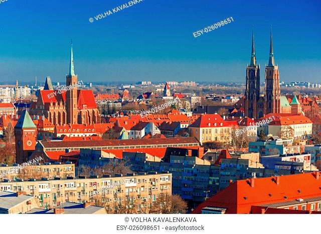 Aerial view of Ostrow Tumski with Cathedral of St. John and church of the Holy Cross and St. Bartholomew from St. Mary Magdalene Church in the morning in...