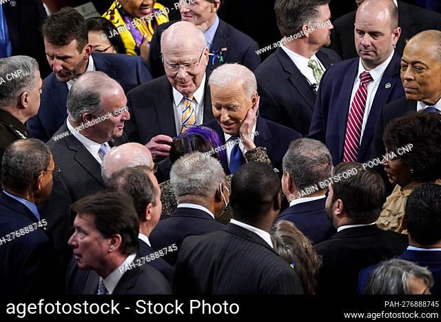 WASHINGTON, DC - MARCH 01: President Joe Biden is greeted by democrats after delivering his State of the Union address to a joint session of Congress on Capitol...