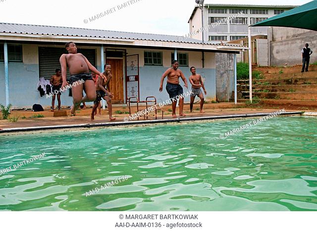 School boys jumping into swimming pool, St Mark's School, Mbabane, Hhohho, Kingdom of Swaziland