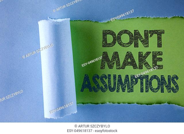 Conceptual hand writing showing Do not Make Assumptions. Business photo text predict events future without clue Alternative Facts written under Tear Folded...