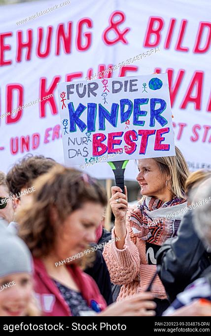 23 September 2023, Hamburg: A demonstration participant holds a sign with the inscription ""For the children only the best""