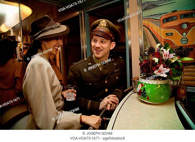 1940's Army reenactor flirts with woman at bar on Pearl Harbor Day Troop train reenactment from Los Angeles Union Station to San Diego