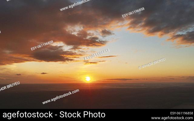 Aerial View Of Sunshine Bright Dramatic Sky. Scenic Colorful Sky At Dawn. Sunset Sky Above Autumn Field And Meadow, Forest Landscape In Evening