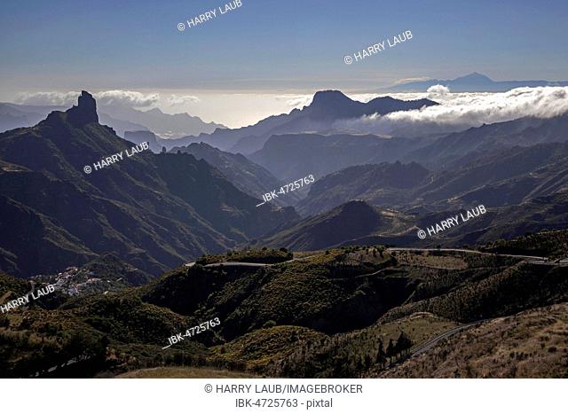 View from Cruz de Tejeda into the Tejeda caldera, Barranco de Tejeda, Cult rock Roque Bentayga, Altavista mountain, Tenerife island with Teide volcano