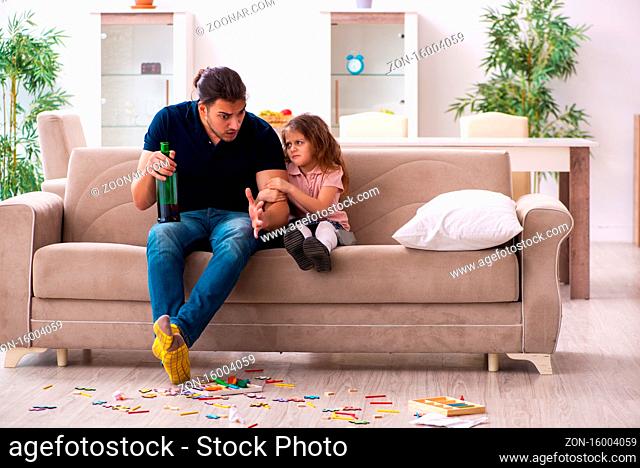 Drunk father and little girl at home