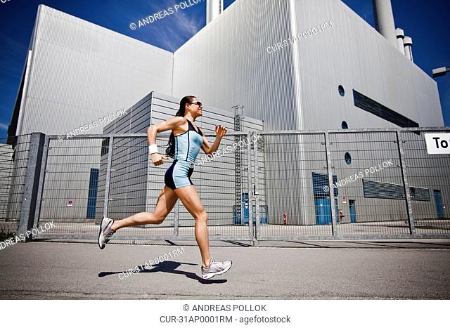 Woman running in city
