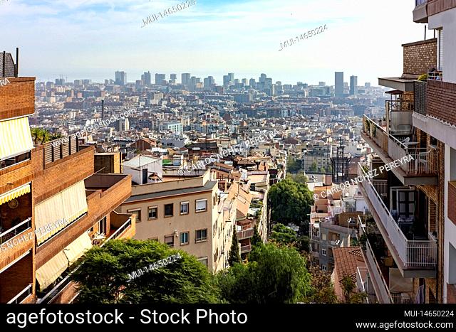Aerial view of the city of Barcelona from a residential area and in the background modern office buildings