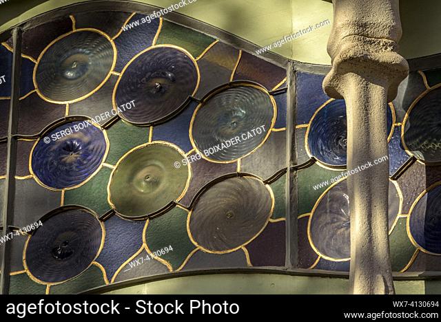 ENG: Detail of the large window of the noble floor of the Casa Batlló with columns of bone shapes and plant motifs (Barcelona, Catalonia, Spain)