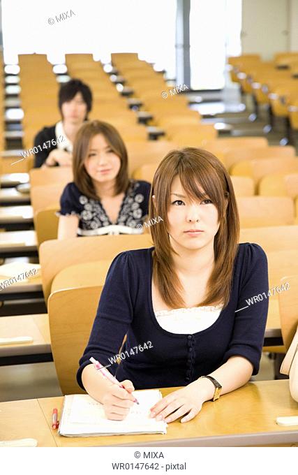 College students studying in lecture room