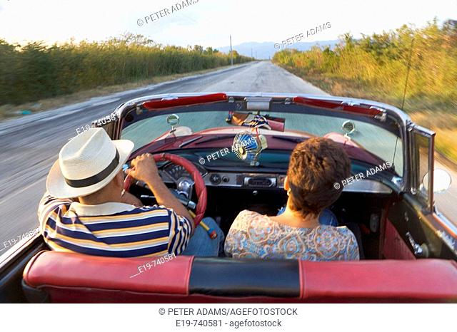 Couple in 1950 Chevrolet convertible, Cuba