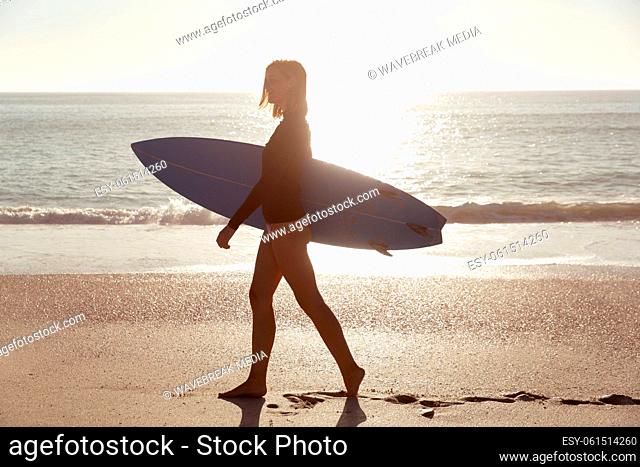 Caucasian woman during surf session at beach