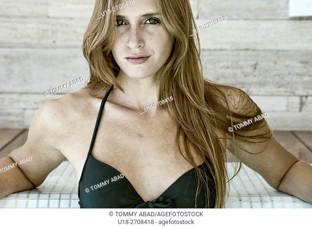 Blonde woman in black bikini