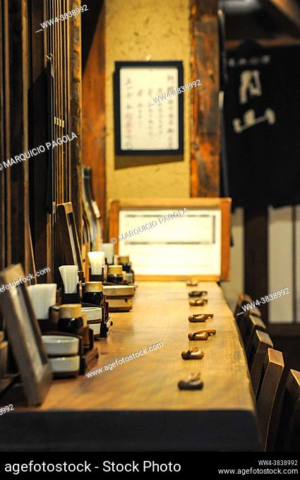 Details of a restaurant bar with all the items for diners over the table, Tokyo, Japan