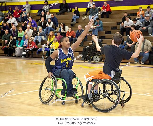 Warren, Michigan - The Sterling Heights Challengers, a team of disabled high school students, plays wheelchair basketball against non-disabled faculty and staff...
