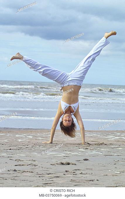 Happy cartwheel beach Stock Photos and Images | agefotostock