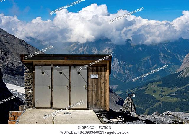 Toilet house with panorama view at the mountain refuge Fruendenhuette of the Swiss Alpine Club (SAC) near Kandersteg, Bernese Oberland, Switzerland