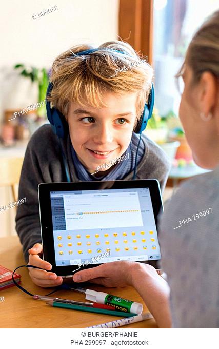 8 year old boy using tablet computer