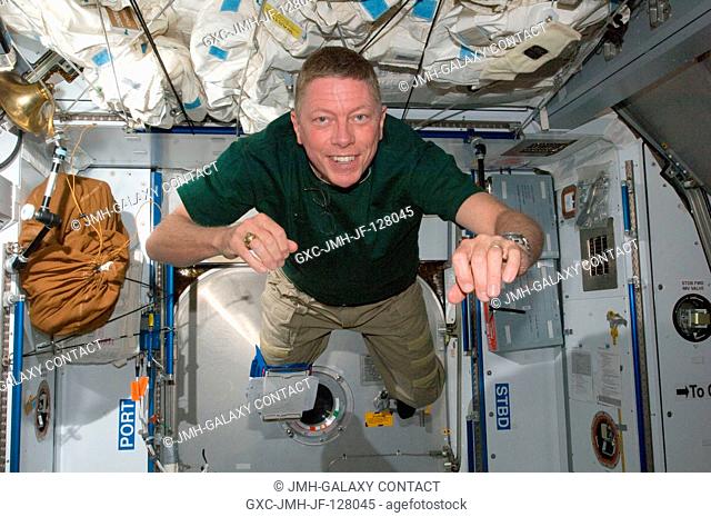 NASA astronaut Mike Fossum, Expedition 28 flight engineer, is pictured floating freely in the Harmony node of the International Space Station