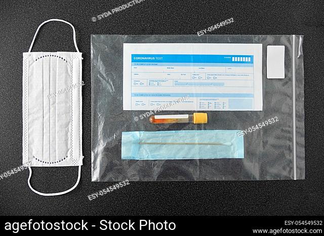 test tube, medical report, cotton swab and mask