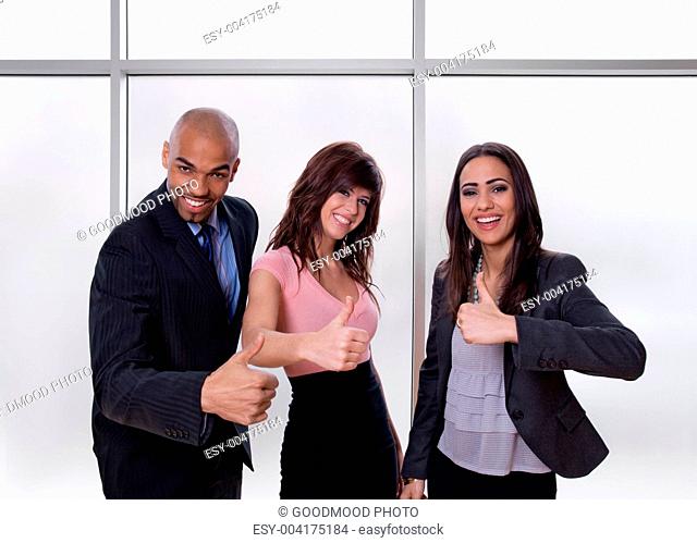 Multiethnic business team showing thumbs up