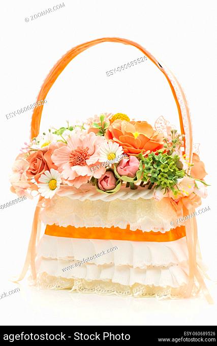 Stylish bridal bouquet made as basket with flowers isolated over white background
