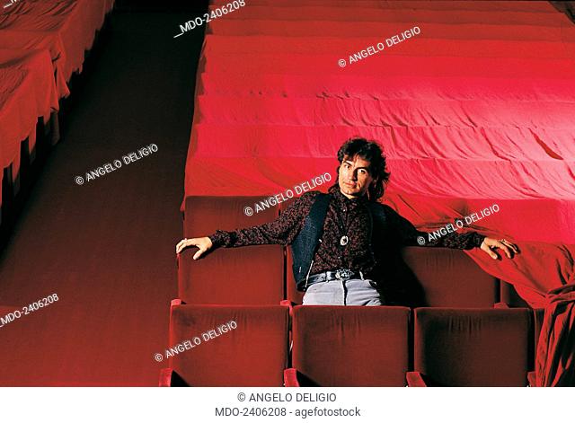 Italian singer-songwriter Luciano Ligabue (Luciano Riccardo Ligabue) sitting on some uncovered armchairs in the stalls of the Theatre Asioli in a photocall...