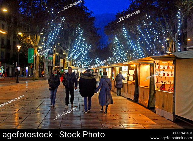 artisan market and Christmas lighting 2021 on the Rambla de Santa Mónica, Barcelona, Catalonia, Spain