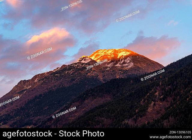 Beautiful panorama of the snow-covered Orobie mountains of the Seriana Valley and the Sedornia Valley at sunset