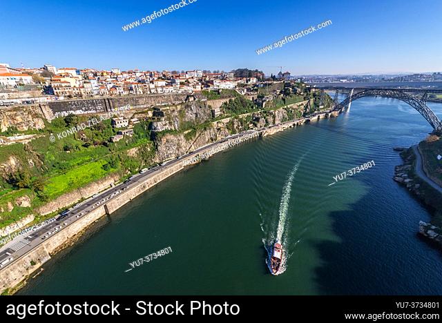 View from Infante D. Henrique Bridge on a Maria Pia Bridge old railway bridge over Douro river between Porto (L) and Vila Nova de Gaia, Portugal